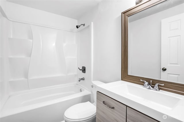 full bathroom featuring shower / bath combination, vanity, and toilet