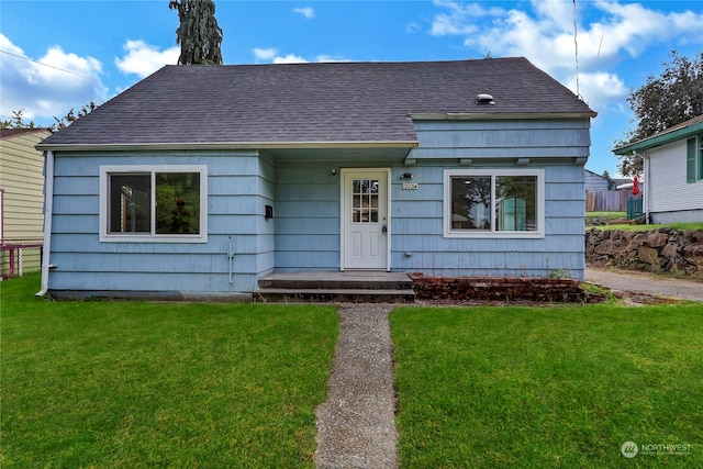 bungalow with a front lawn