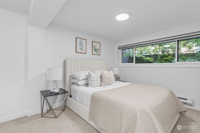 carpeted bedroom with baseboard heating