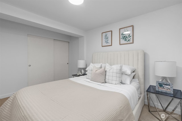 carpeted bedroom featuring a closet