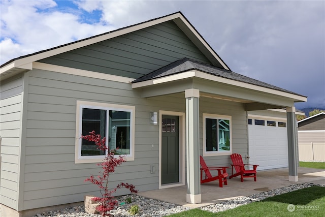 back of house featuring a porch