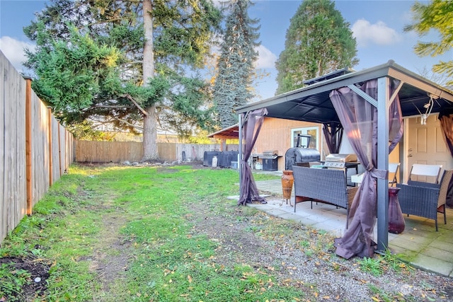 view of yard featuring a gazebo and a patio