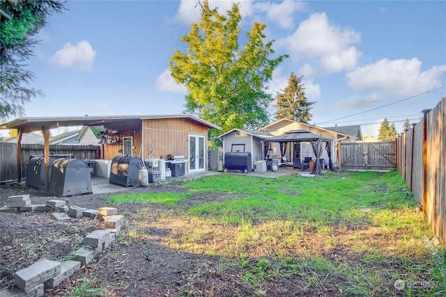 view of yard featuring a gazebo and a patio area