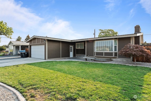 ranch-style house with a front yard and a garage