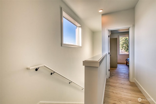 corridor with light hardwood / wood-style flooring