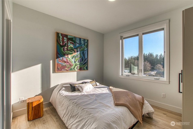 bedroom with light hardwood / wood-style floors