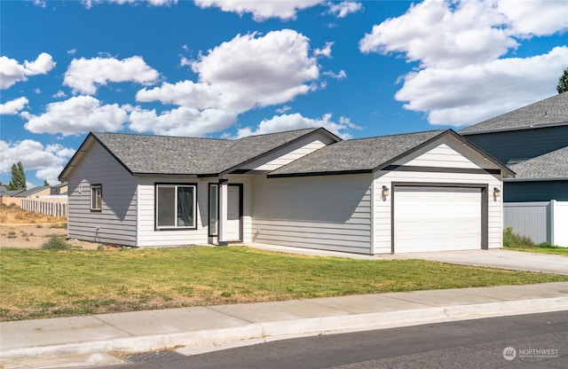 ranch-style house featuring a front lawn and a garage