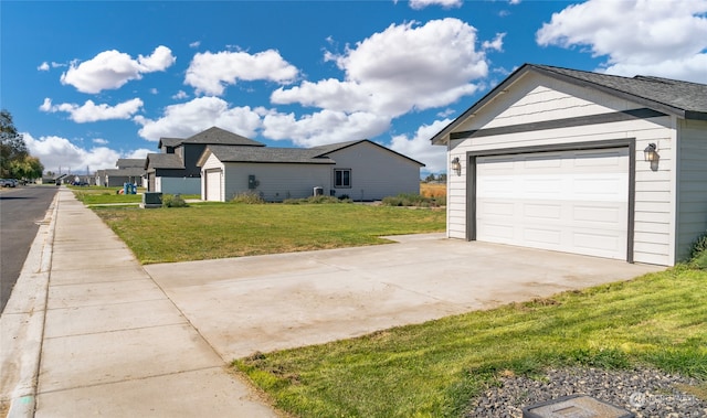 exterior space featuring a yard and a garage