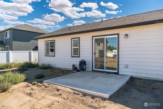 rear view of property featuring a patio area