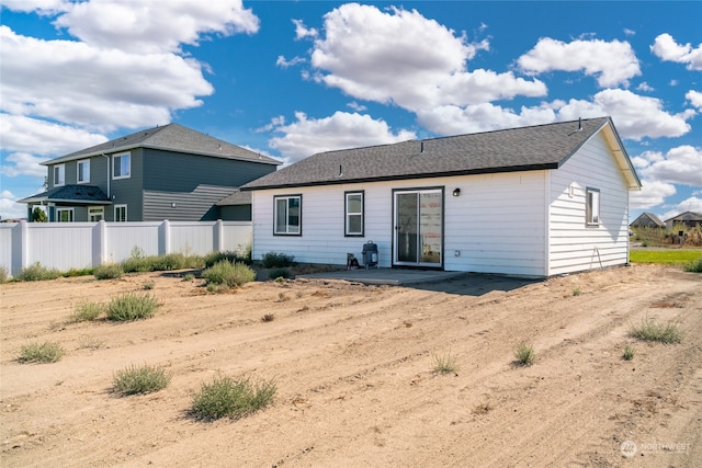 back of property with a patio