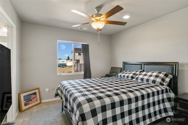 bedroom with ceiling fan and carpet