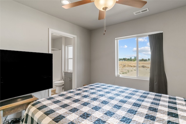 bedroom featuring ensuite bath and ceiling fan