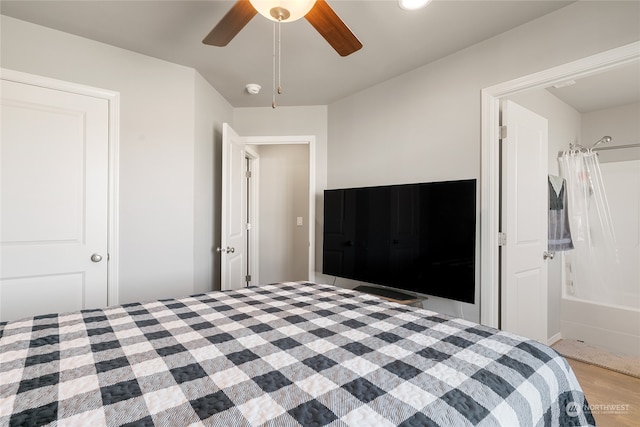 unfurnished bedroom with ceiling fan and light wood-type flooring