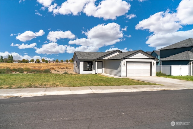 view of front of property featuring a garage and a front yard