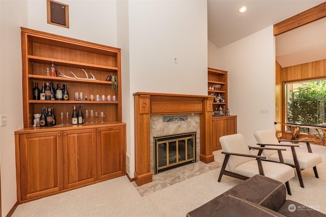 interior space featuring light colored carpet, a fireplace, high vaulted ceiling, and recessed lighting