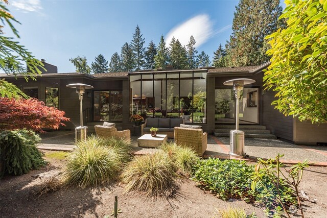 exterior space featuring outdoor lounge area and a patio