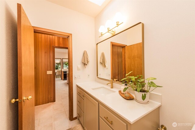 bathroom featuring tile patterned flooring and vanity