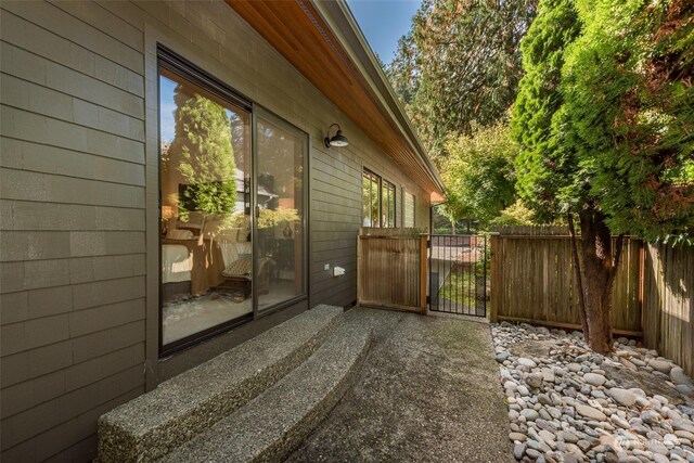 view of side of property with a patio