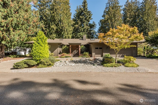 view of front of property with driveway and a garage
