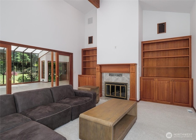 125 Arnold Palmer Pkwy, Sequim, WA 98382 - living area with high vaulted ceiling, a fireplace, and light colored carpet