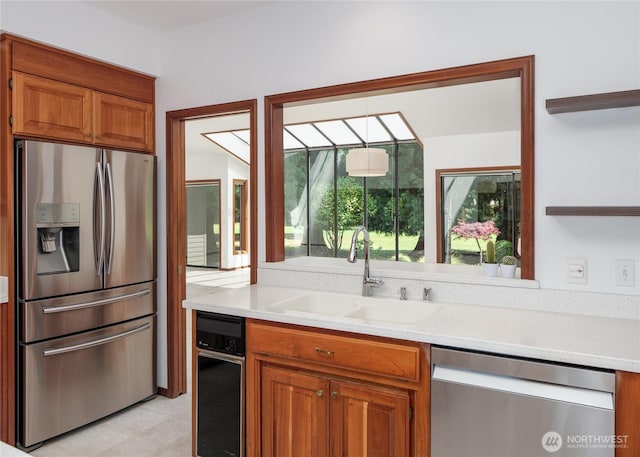 125 Arnold Palmer Pkwy, Sequim, WA 98382 - kitchen featuring stainless steel appliances, open shelves, light countertops, brown cabinets, and light tile patterned floors