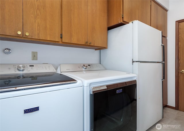 125 Arnold Palmer Pkwy, Sequim, WA 98382 - laundry area featuring separate washer and dryer and cabinet space