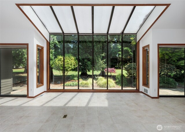 125 Arnold Palmer Pkwy, Sequim, WA 98382 - unfurnished sunroom with plenty of natural light, a wall of windows, and tile patterned flooring