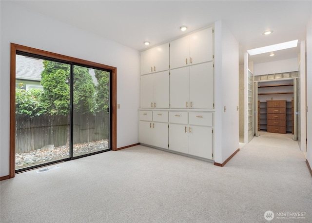 125 Arnold Palmer Pkwy, Sequim, WA 98382 - unfurnished bedroom with access to outside, light colored carpet, and recessed lighting