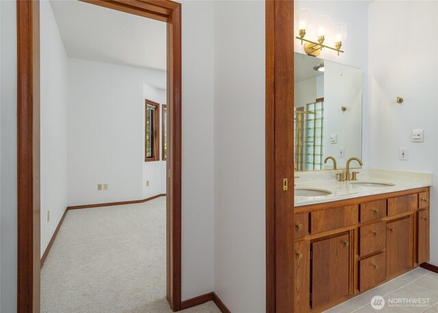 125 Arnold Palmer Pkwy, Sequim, WA 98382 - full bathroom with double vanity and baseboards