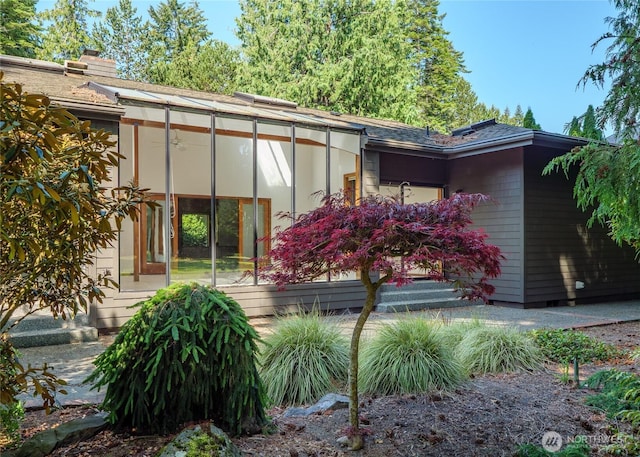 125 Arnold Palmer Pkwy, Sequim, WA 98382 - back of house with a sunroom