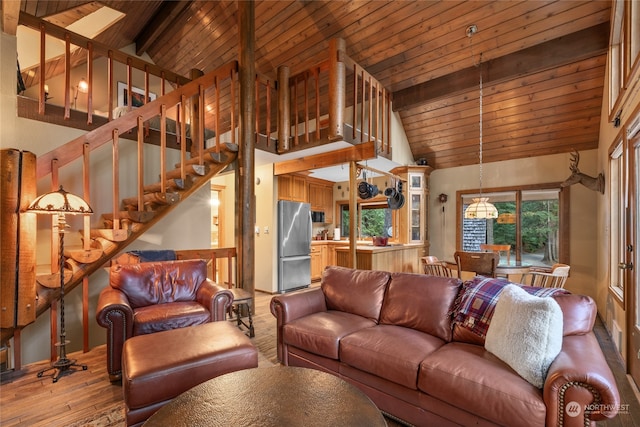 living room featuring high vaulted ceiling, wooden ceiling, hardwood / wood-style floors, and beamed ceiling