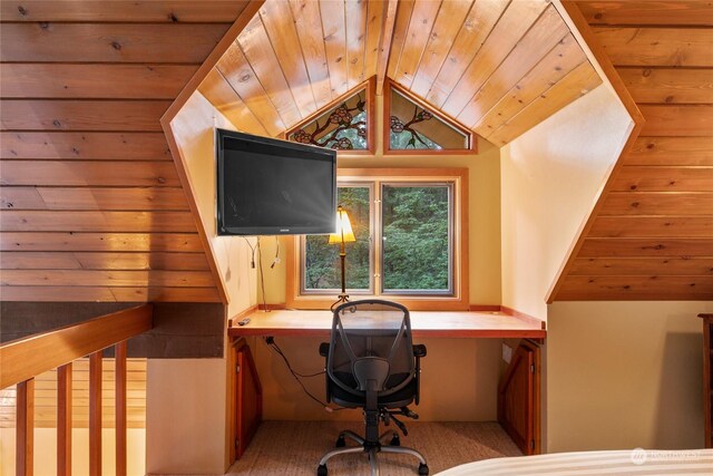 home office featuring wood ceiling, built in desk, and lofted ceiling