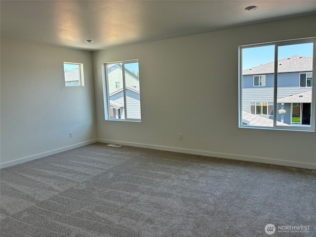 12707 172nd Avenue Ct E Unit 135, Bonney Lake, WA 98391 - spare room with dark carpet and baseboards