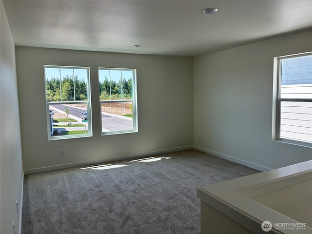 12707 172nd Avenue Ct E Unit 135, Bonney Lake, WA 98391 - unfurnished room featuring carpet floors and baseboards