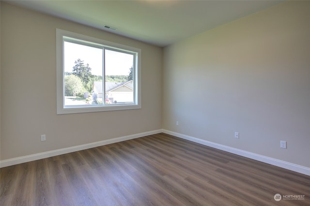 empty room featuring dark hardwood / wood-style floors