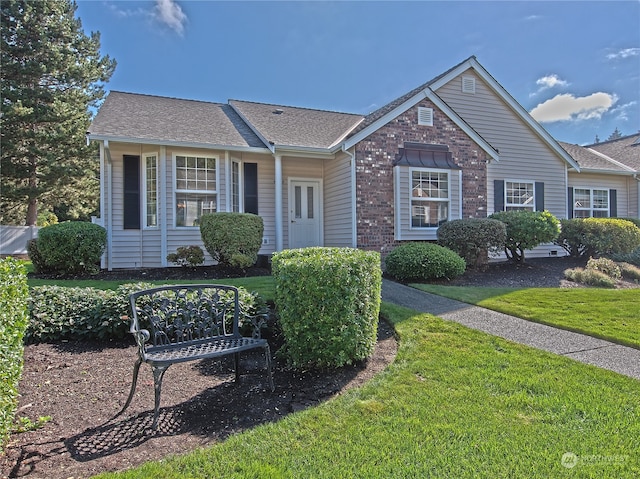 single story home with a front yard