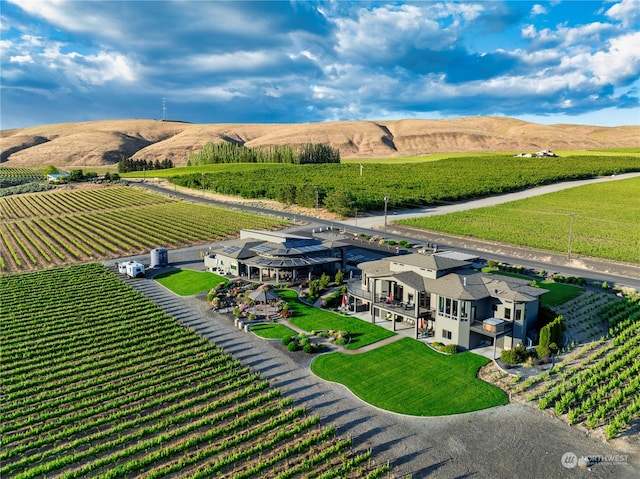 birds eye view of property with a rural view