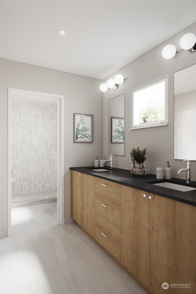 bathroom with vanity, a shower, and tile patterned flooring