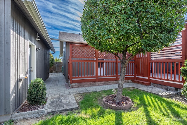 view of yard with a patio and a deck