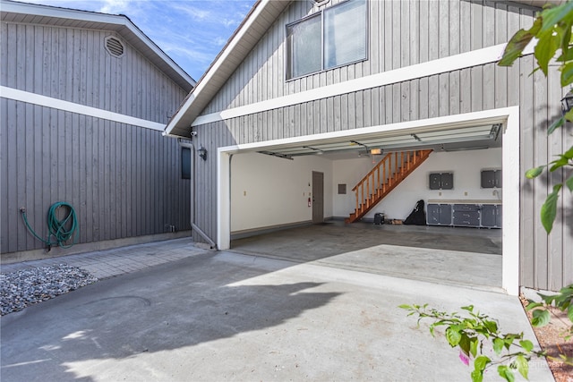 garage featuring wooden walls