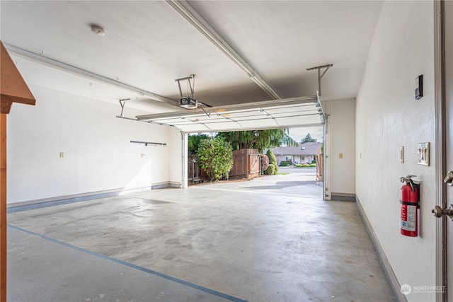 garage featuring a garage door opener