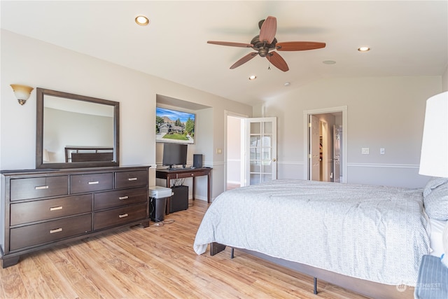 bedroom featuring connected bathroom, ceiling fan, vaulted ceiling, and light wood-type flooring