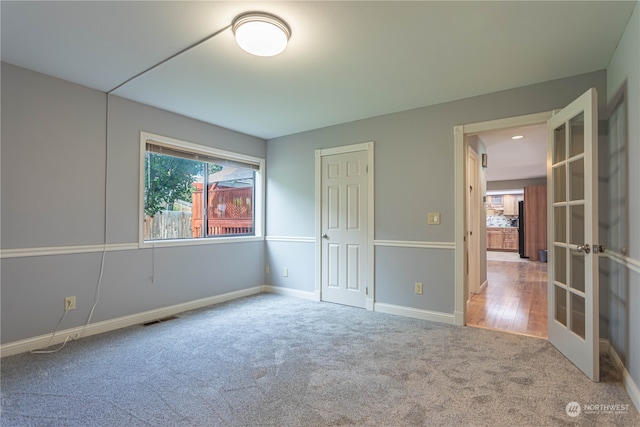 empty room with hardwood / wood-style flooring