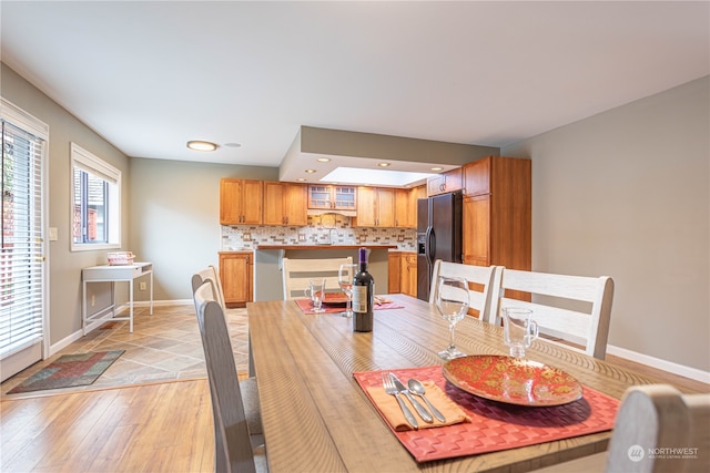 dining area with light wood-type flooring