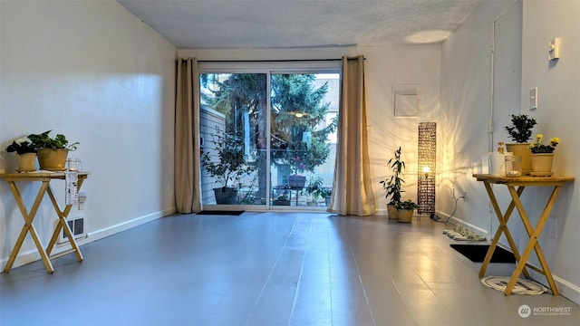 interior space featuring a textured ceiling