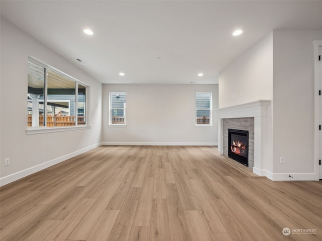 unfurnished living room featuring light hardwood / wood-style floors