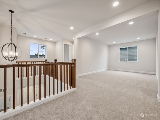 interior space with a chandelier and light carpet