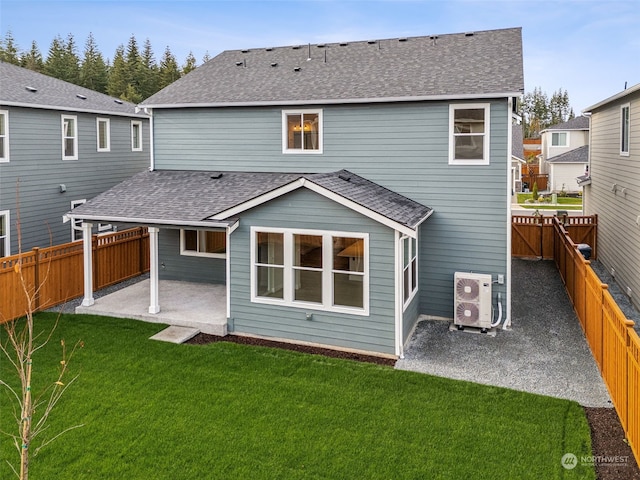 rear view of property with ac unit, a patio area, and a yard