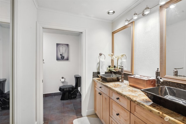 bathroom featuring vanity, ornamental molding, and tile patterned flooring