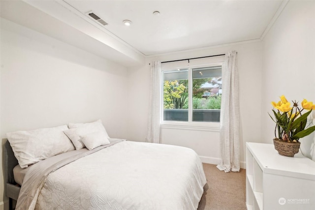 520 SE Columbia River Dr Unit 120, Vancouver, WA 98661 - bedroom featuring crown molding, light carpet, baseboards, and visible vents